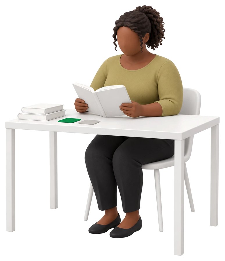 Someone reading at a desk